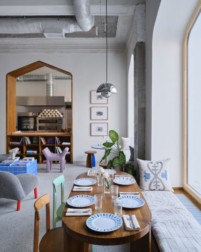 Open bakery and nook seating in FIKA Restaurant in Kazakhstan by NAAW Studio