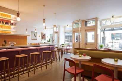 Dining area and bar counter with street windows behind