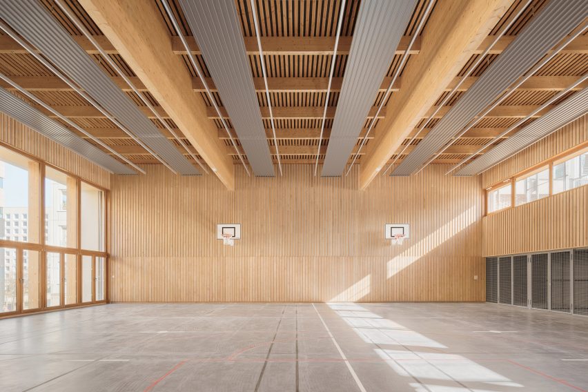 Sports hall with concrete flooring and timber walls