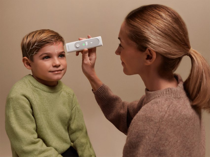Digital collage based on a photo of a woman measuring a child's temperature by holding the Withings BeamO device near their forehead, with a small digital illustration of veins in the child's head glowing red on one side indicating a hot area