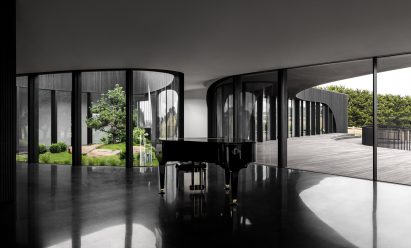 Black home interior with an atrium by Wood Marsh