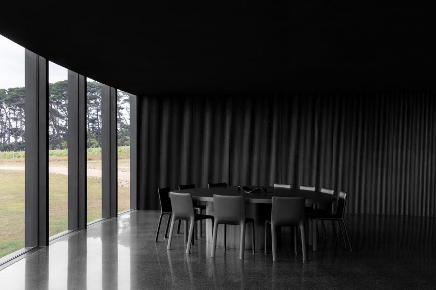 Dining room with charred timber wall cladding