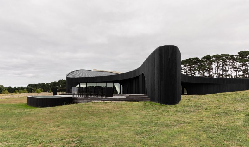 Curvaceous house in Melbourne with charred timber cladding