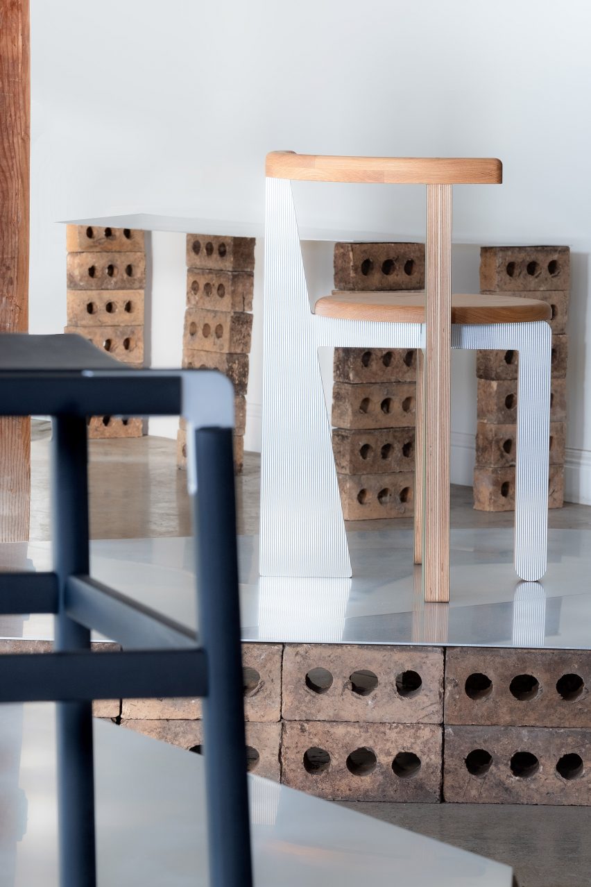 Wooden chair and black stool