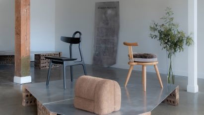 chairs and stools in room with plant