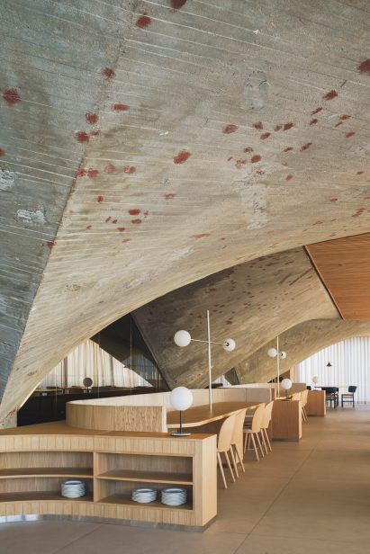 Interior of brutalist Cantabrian Maritime Museum restaurant in Spain by Zooco Estudio