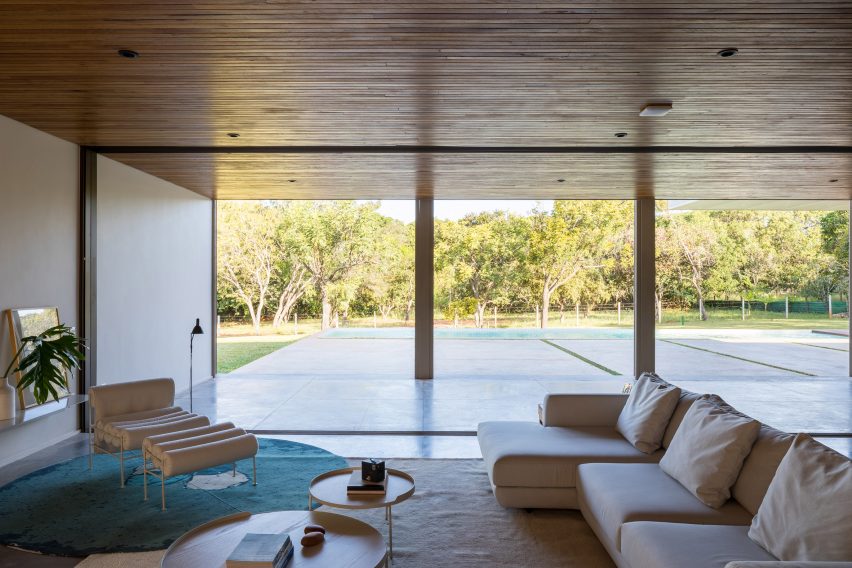 A serene living room with large windows