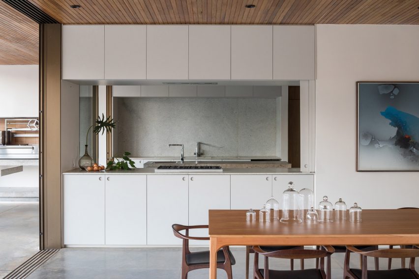 A kitchen with white cabinets
