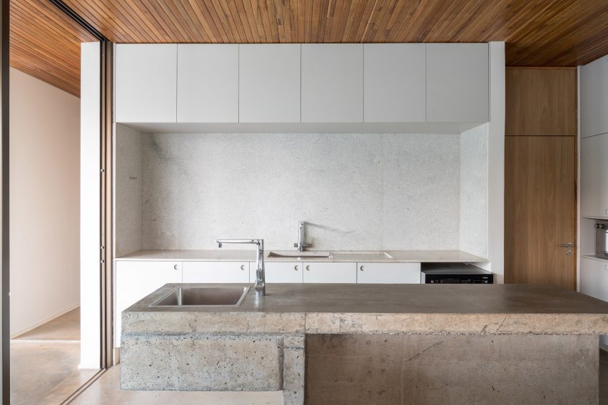 A kitchen with white cabinets