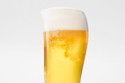 Close-up of asymmetrical Sapporo glass