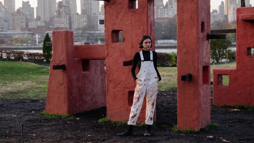 Photo of Maryam Turkey next to a sculptural structure