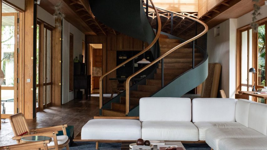 Wooden spiral staircase in a living room