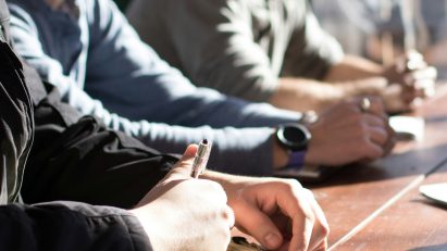 Men sitting around an office table