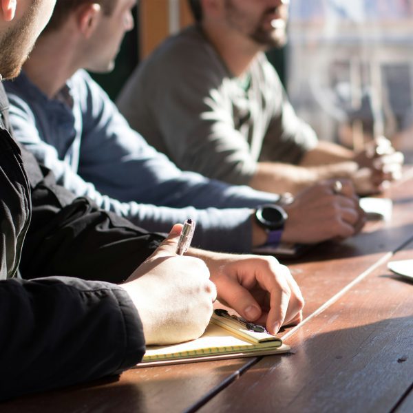Men sitting around an office table