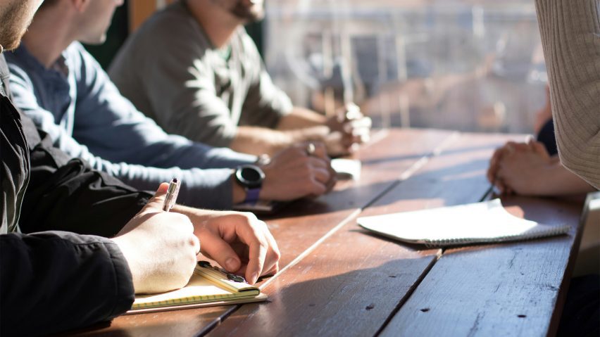 Men sitting around an office table