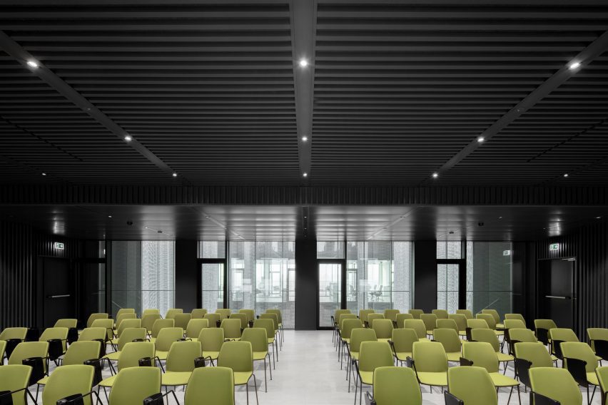 Office meeting space with green chairs