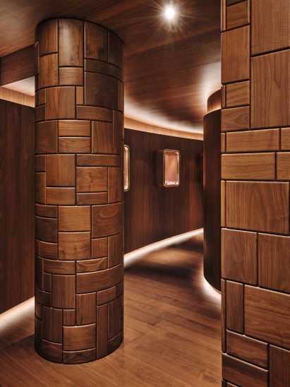 Walnut has been carved to look like Bottega's famous intrecciato woven leather technique