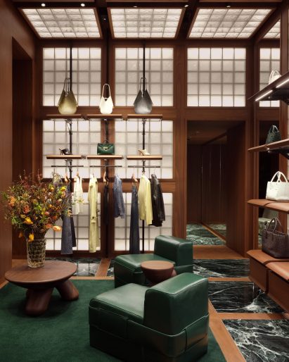 Fashion store with glass-block walls and ceiling, and green marble flooring