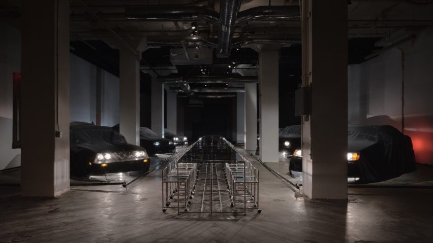 Row of black cars with minimalist furniture