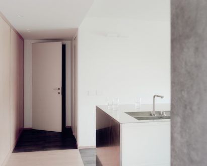 Reflective kitchen interior of cork-clad home in Italy