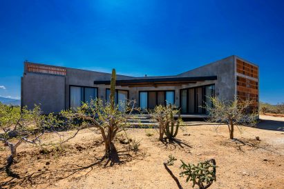 Concrete home with screens gate