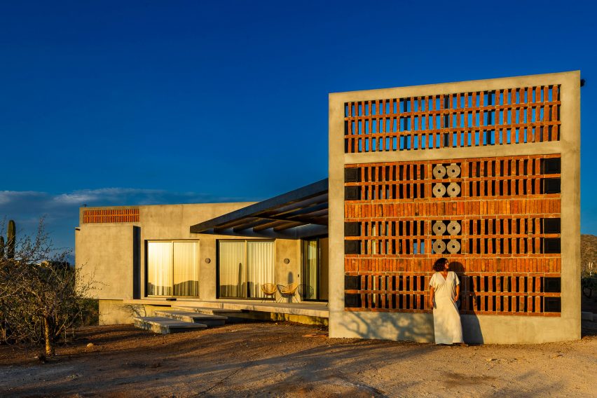 Wooden gate on concrete house