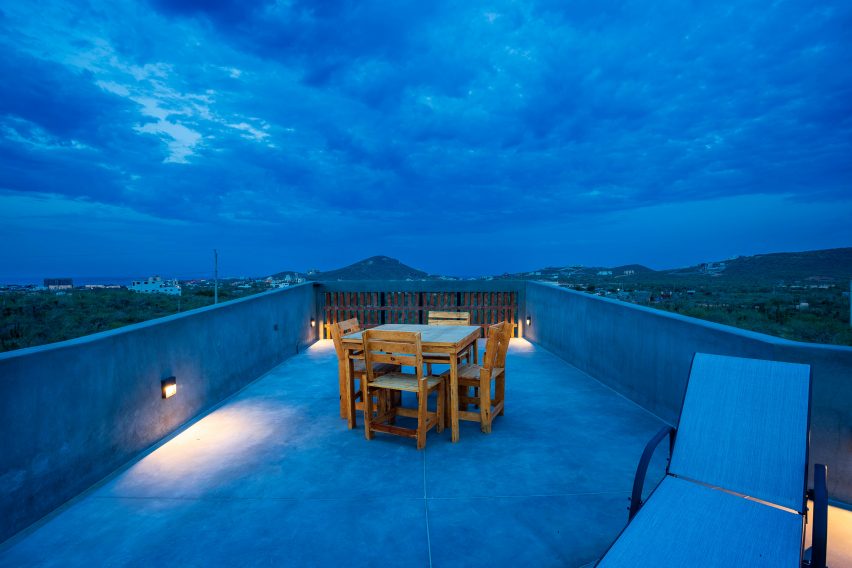 Concrete porch with tables and chairs