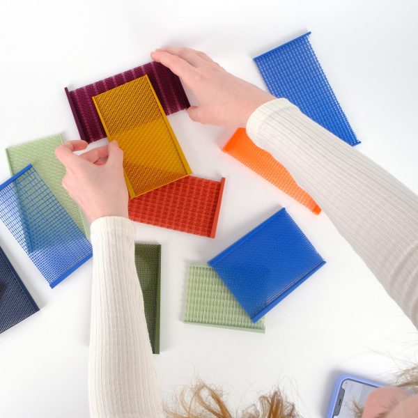person testing out material samples