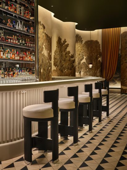 Bar with glass countertop and fluted front