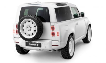 Rear ride view of the Firmship Land Rover Defender, showing a British Heritage spare wheel on the rear door