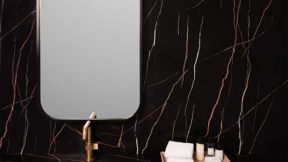 Dark surface by Formica Corporation covering bathroom counter