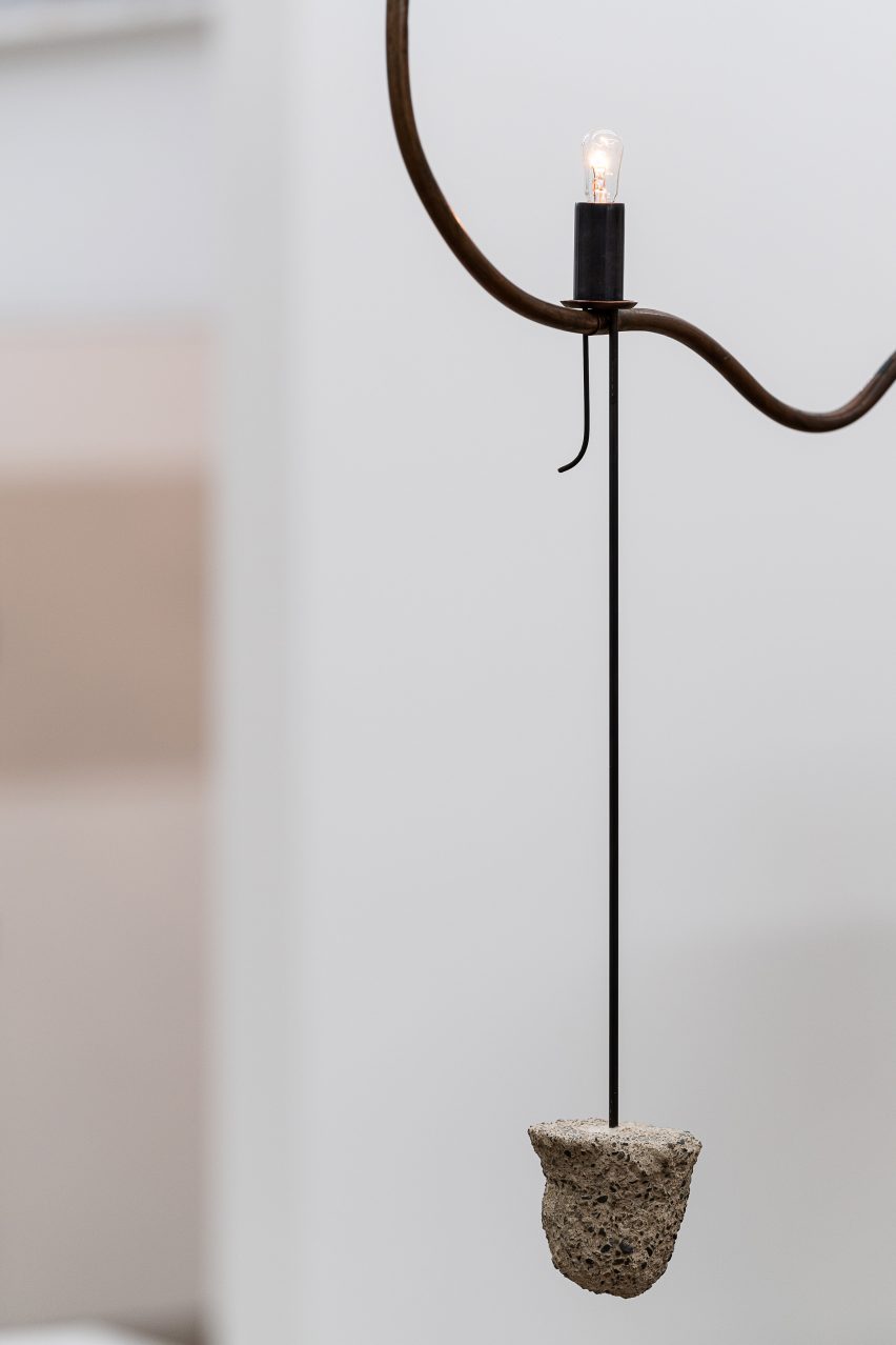 A birds nest tied to chandelier