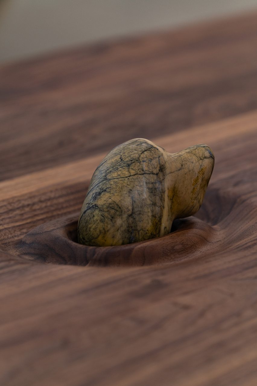 A close up detail of a piece of stone integrated into wood