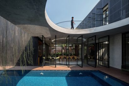 View across swimming pool at Halo House in Indonesia