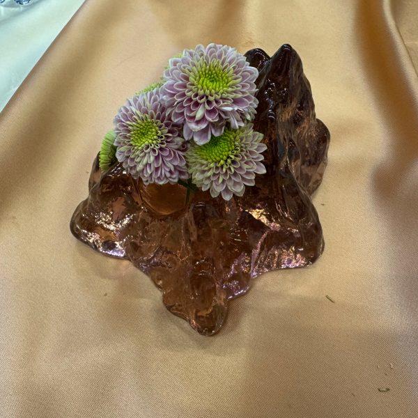 Glass candle holder used as vase