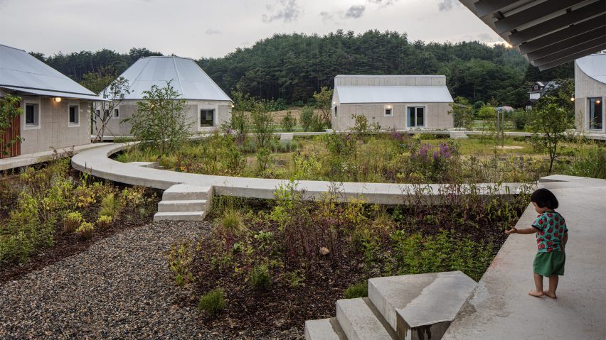 Concrete ring connecting five houses by AOA Architects