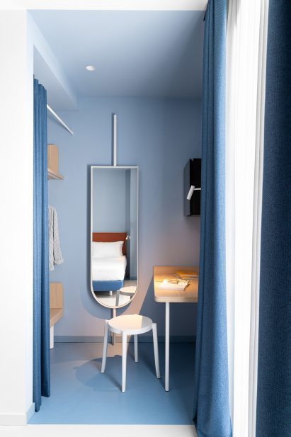 Small desk and wardrobe inside guest room of Hotel Haway in Martinsicuro, Italy