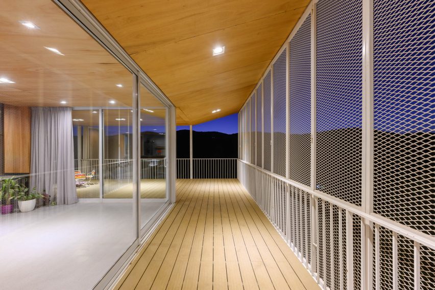 A walkway lining the exterior of a house