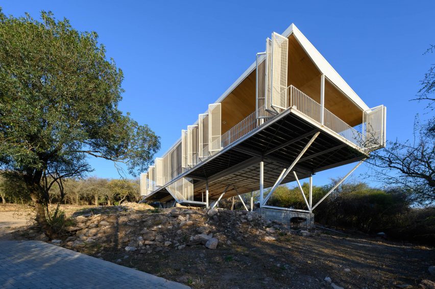 A house suspended on a hill