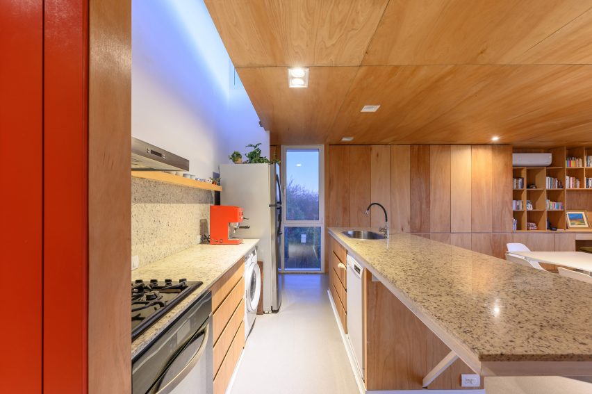 A kitchen with wood cabinetry