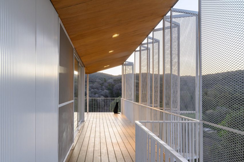 A porch enclosed with white screens