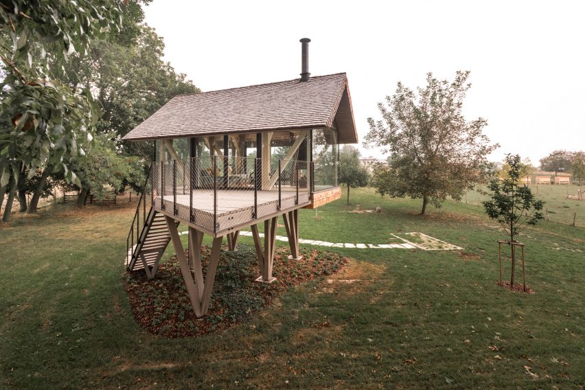 Exterior of glass micro house on stilts by Jan Tyrpekl in Austria