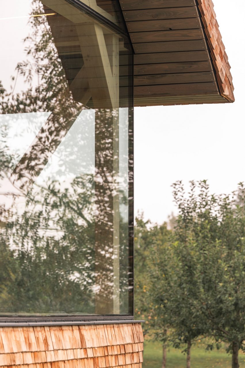 Close up of exterior glazing of micro house on stilts by Jan Tyrpekl in Austria