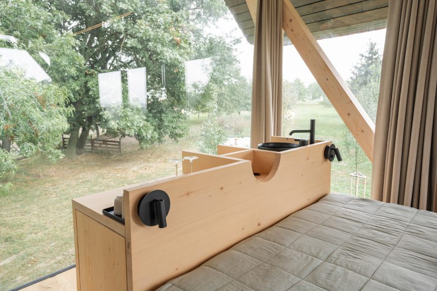 Interior of glass micro house on stilts by Jan Tyrpekl in Austria