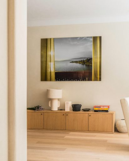 Artwork hanging over console table inside Paris apartment by Johanna Amatoury