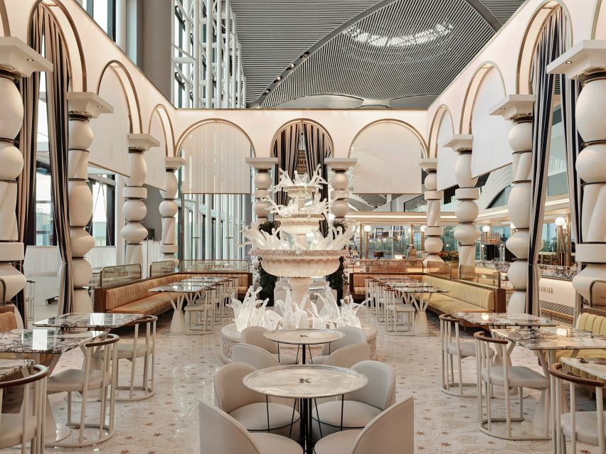 Circular tables and fountain in dining area Kaimakk