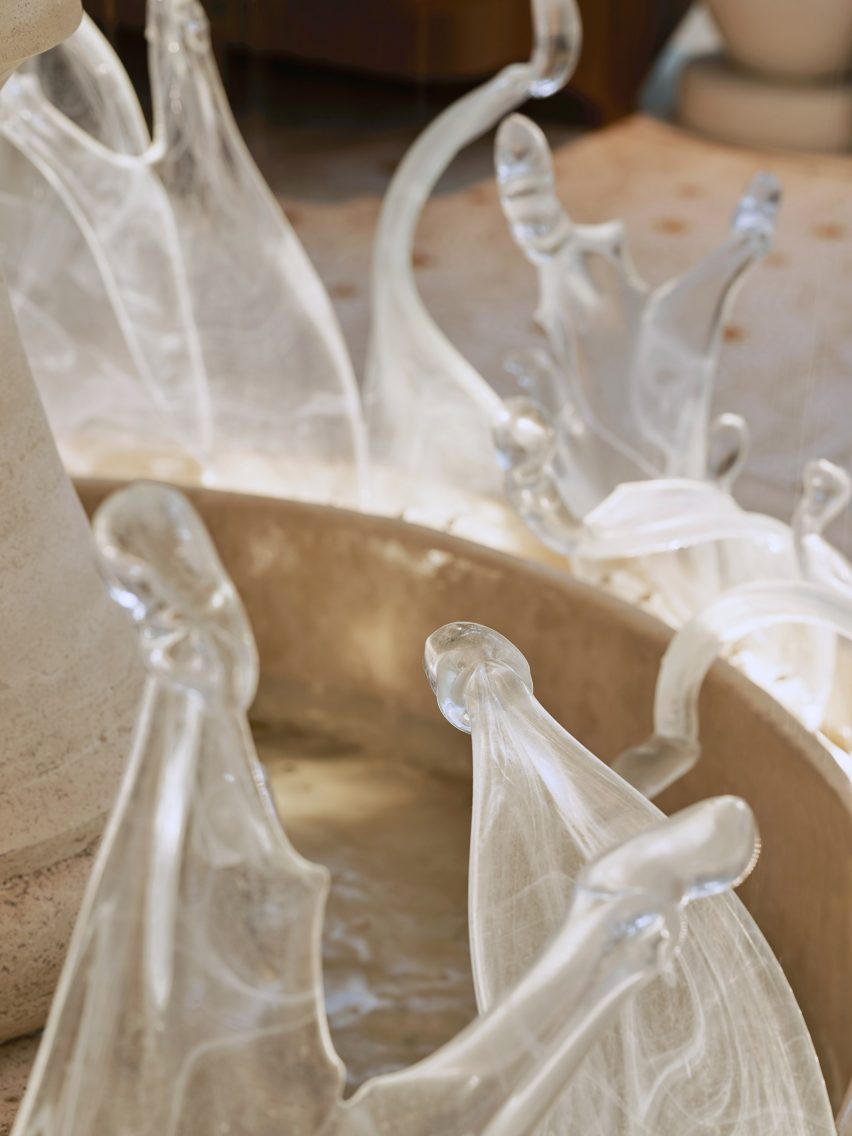 Glass pieces on stone fountain in dining area Istanbul Airport