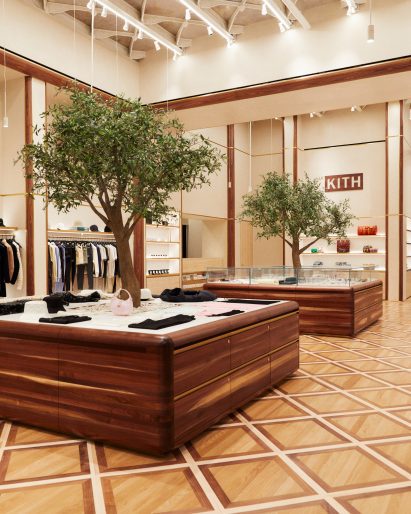 Custom-built walnut podiums with olive trees growing through the centre