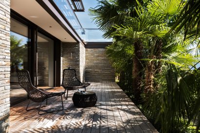 Decked terrace of cantilevered house by Küchel Architects in Switzerland