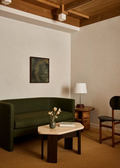 Beige plaster walls and textured carpet in a guest room